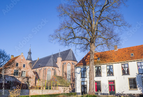 Historic church and white house in Hanseatic city Hattem, Netherlands photo