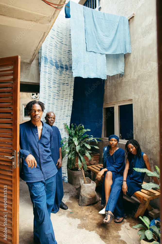 group portrait of african eco textile designers sitting outdoors