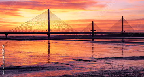 The Mersey Gateway Bridge is a toll bridge between Runcorn and Widnes in Cheshire, England, which spans the River Mersey and the Manchester Ship Canal.