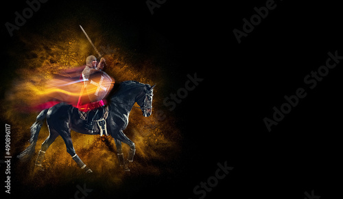 Defending the county. Creative art collage with brutal serious medieval warrior riding horse isolated over dark vintage background with mixed neon light. © master1305