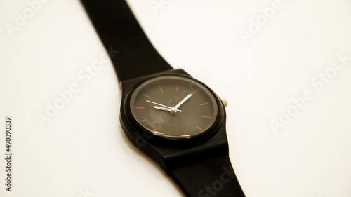 wrist watch that tells the time on white background