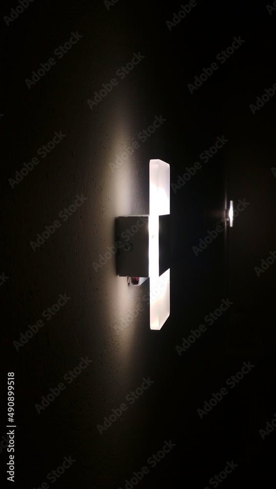 Luxury light on the wall in the dark room