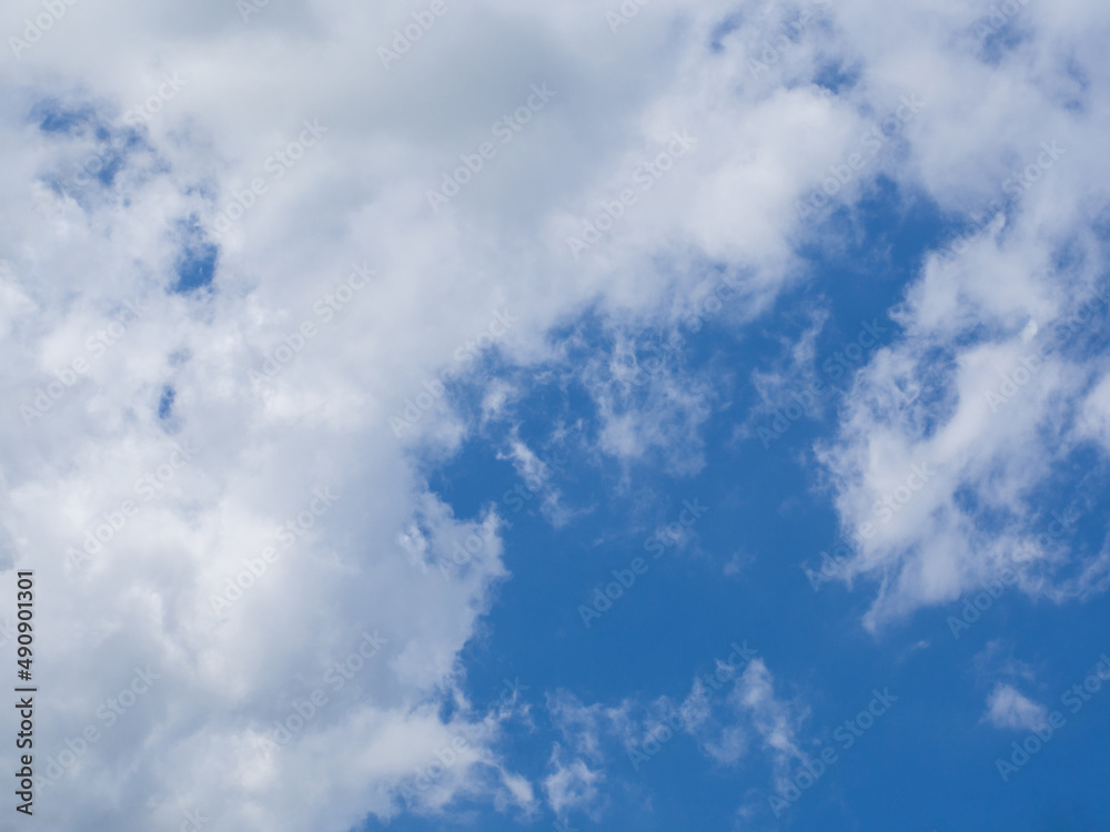 Natural celestial backgrounds. Beautiful cloudy sky. A frame in the form of a clear blue sky in white clouds. Thick white-gray clouds and a blue window. Sky background with solid clouds Natural celestial backgrounds. Beautiful cloudy sky. A frame in the form of a clear blue sky in white clouds. Thick white-gray clouds and a blue window. Sky background with solid clouds