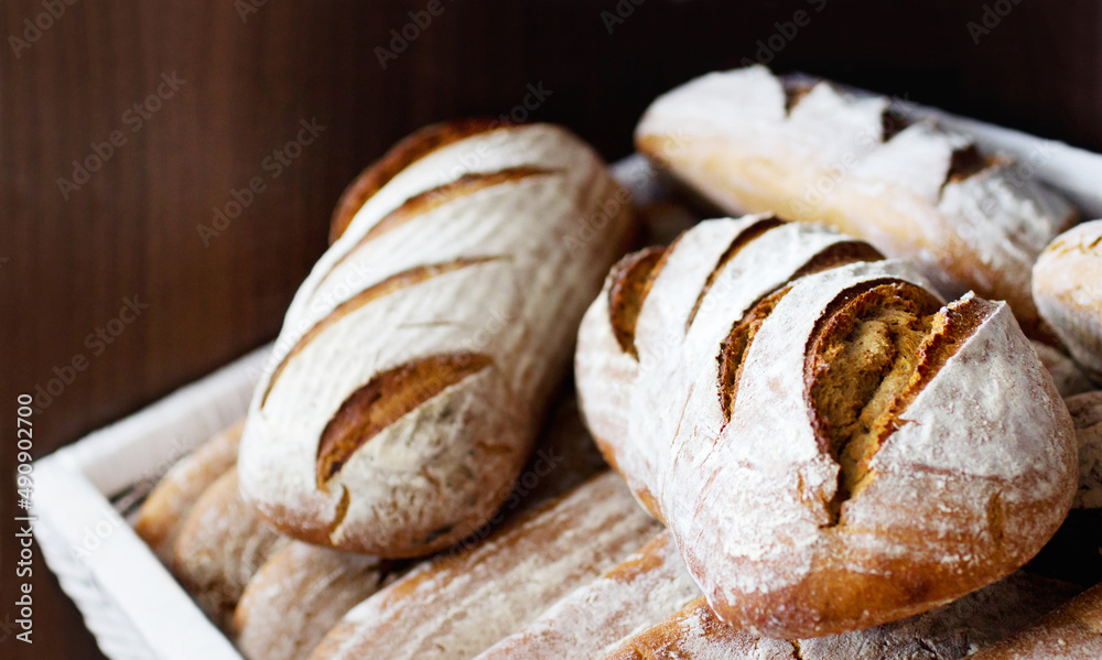 Fresh and warm. Closeup of a pile of freshly-baked bread loaves. Fresh and warm. Closeup of a pile of freshly-baked bread loaves.