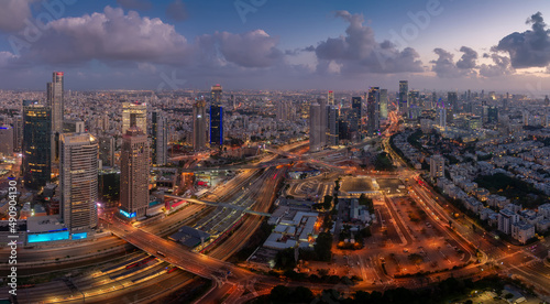 Tel Aviv big evening aerial panorama. Tall modern buildings, highways and living areas