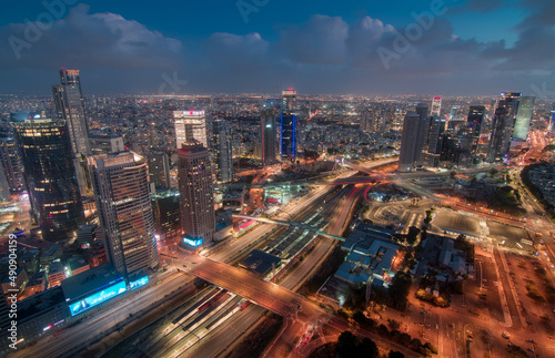 Tel Aviv night view from above. Aerial panorama. Tall modern buildings