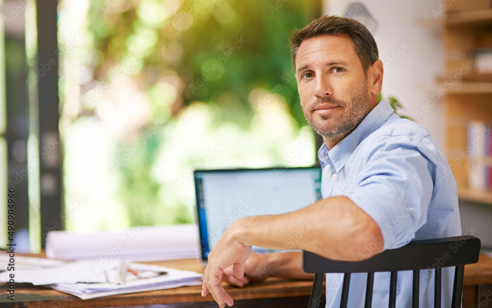 Building my company from the ground, up. Shot of a young man working from home.