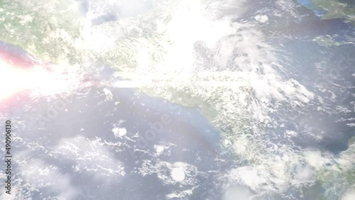 Earth zoom in from outer space to city. Zooming on Soyapango, El Salvador. The animation continues by zoom out through clouds and atmosphere into space. Images from NASA photo