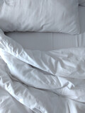 white pillow on the bed