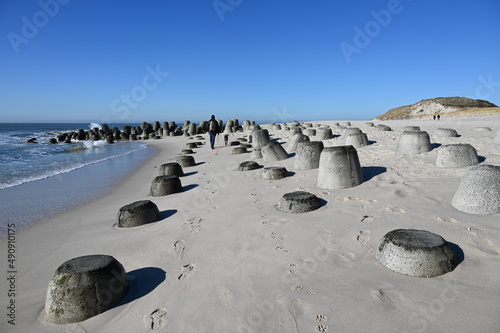 Beach in Hörnum Sylt with wavebreaking Rocks photo