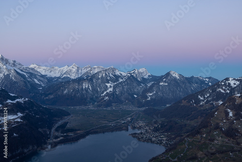 What a wonderful sunrise in the Swiss Alps, in the canton of Glarus to be exact. The sky turns red and pink over the mountain peaks.