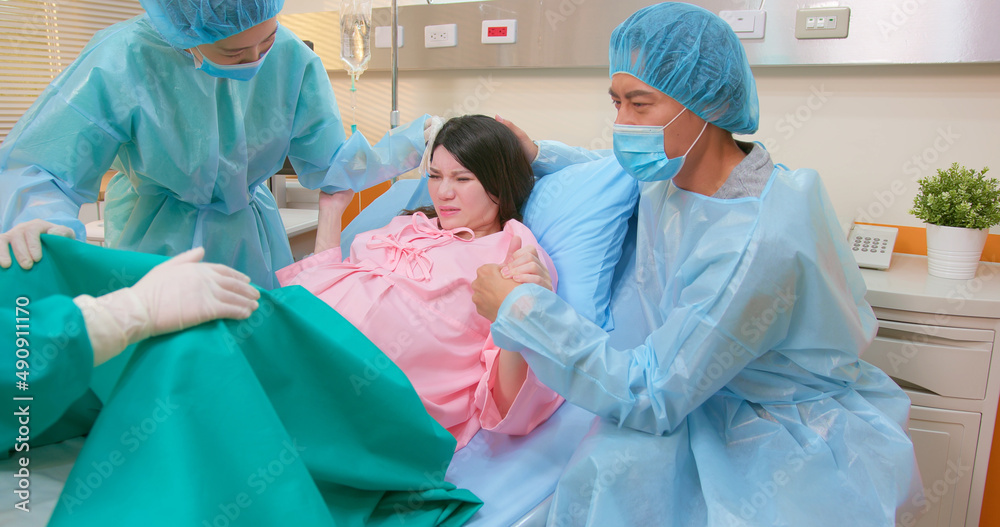 pregnant woman in delivery room pregnant woman in delivery room