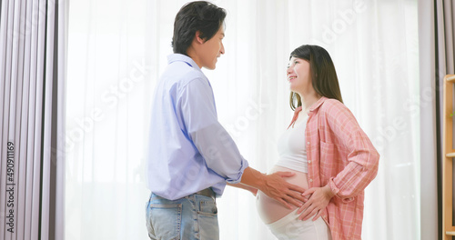 asian pregnant couple feel love