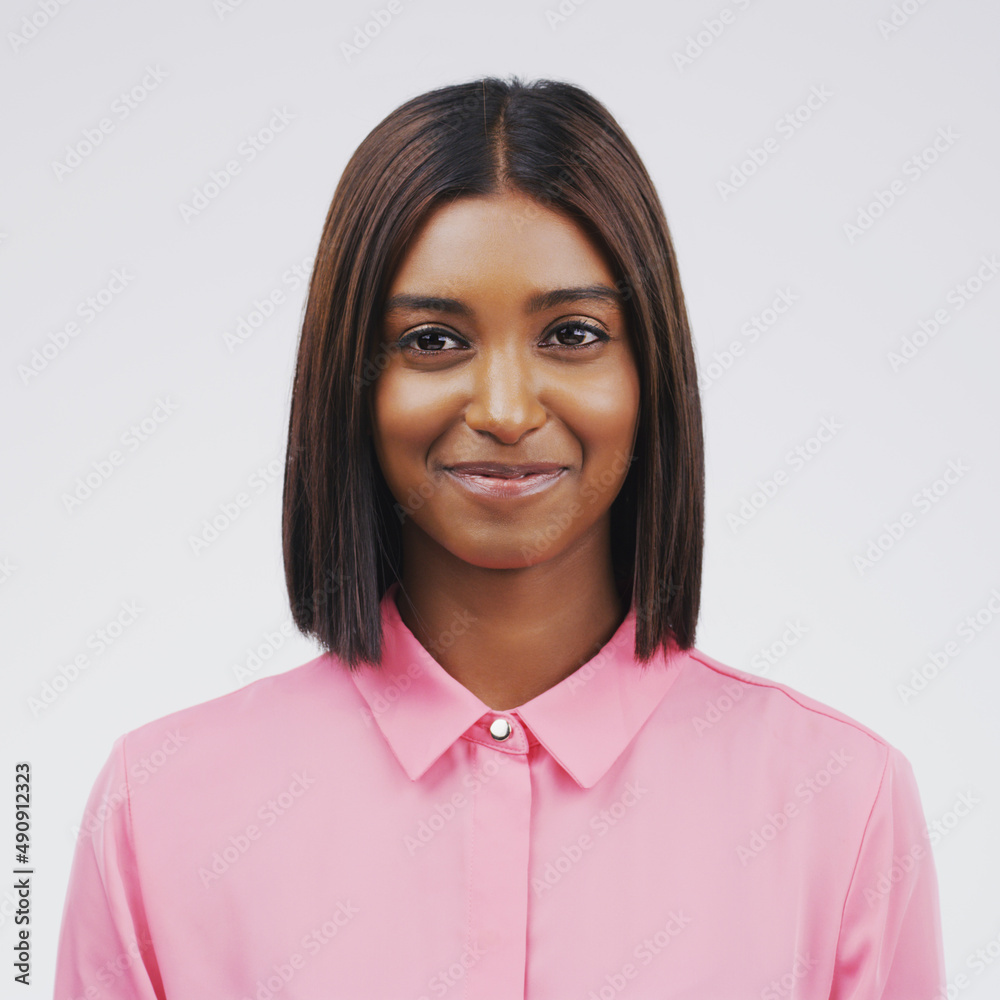 Its written all over her face. Studio portrait of an attractive young woman posing against a grey background. Its written all over her face. Studio portrait of an attractive young woman posing against a grey background.