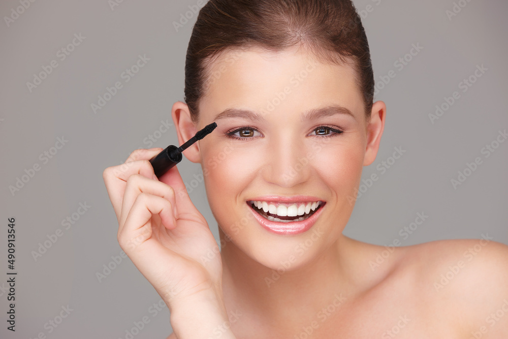 Making sure my eyes stand out. Studio portrait of a beautiful woman applying mascara. Making sure my eyes stand out. Studio portrait of a beautiful woman applying mascara.