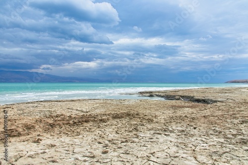 The Dead Sea is a salt lake in Israel at the lowest point on earth of 430 meters below sea level. The drop rate of the sea surface is 1 meter per year causing appearance of sinkholes and salt crystals