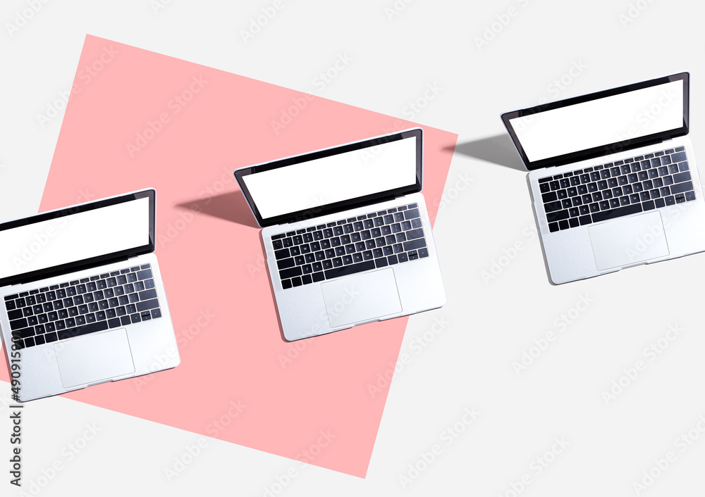 Three laptop computers with shadow - Flat lay Three laptop computers with shadow - Flat lay
