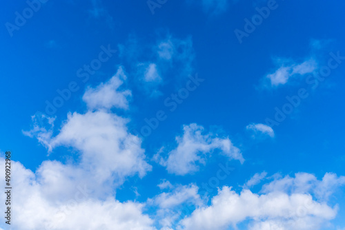 White clouds in front of a blue sky