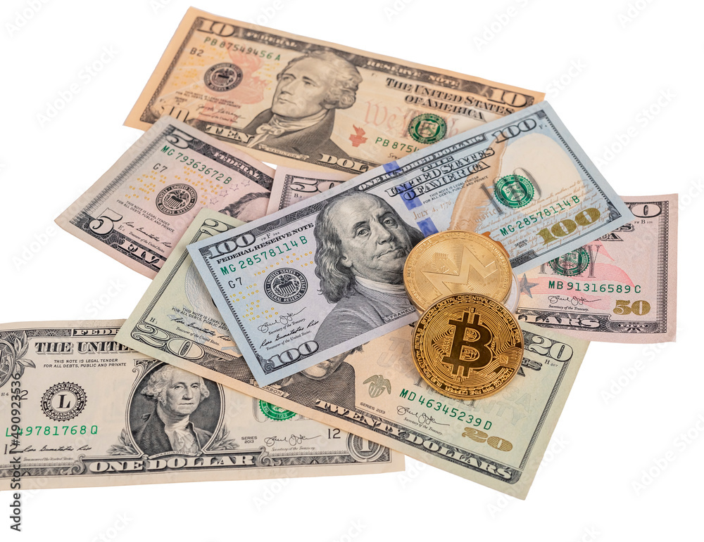Bitcoin coins at dollar notes pile isolated on white background. Cryptocurrency and cash money concept. High quality photo