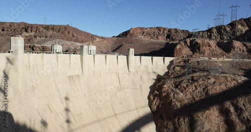 Hoover Dam canyon power plant river pan. Hoover Dam a concrete structure on the Colorado River forming Lake Mead between Nevada and Arizona. Construction started 1931 during the Great Depression.