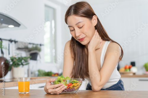 Diet, Dieting, pretty slim asian young woman or girl smiling, looking at mix vegetables, green salad bowl, eat vegetarian food is low fat good healthy. Nutritionist weight loss for health person.
