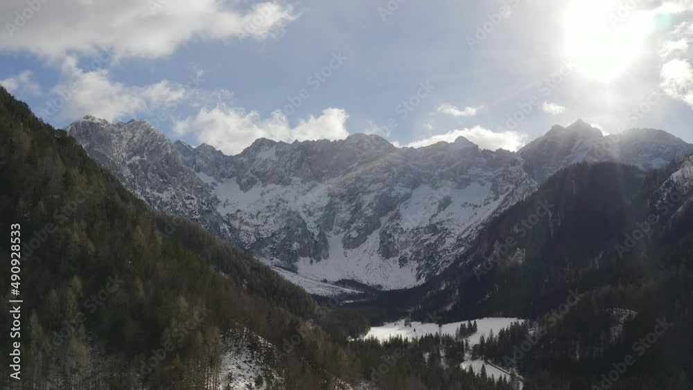 Snowy mountain Alps in Jezersko, Slovenia in winter. Landscape of highland nature aerial panning shot. Snowy mountain Alps in Jezersko, Slovenia in winter. Landscape of highland nature aerial panning shot.