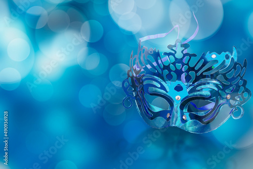 Fototapeta Naklejka Na Ścianę i Meble -  Carnival Mask With Abstract Defocused Bokeh Lights background. festival. Copy space,