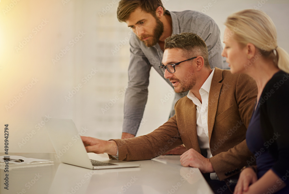 Ive got some great designs to show you. Cropped shot of three businesspeople looking at a laptop in the boardroom. Ive got some great designs to show you. Cropped shot of three businesspeople looking at a laptop in the boardroom.