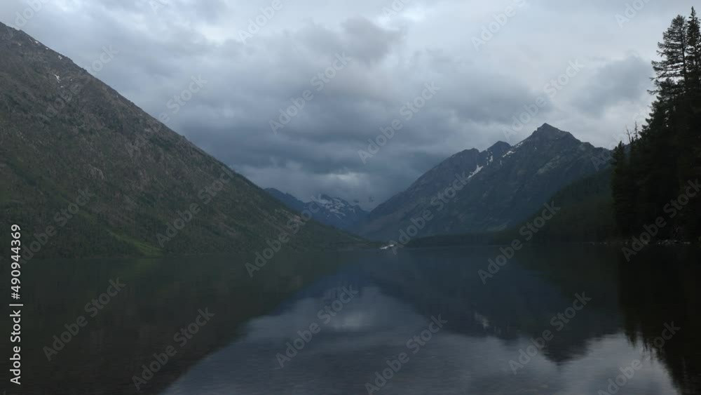 Timelapse video of a mountain lake on a cloudy day. Atmospheric landscape of fishing and hiking Timelapse video of a mountain lake on a cloudy day. Atmospheric landscape of fishing and hiking