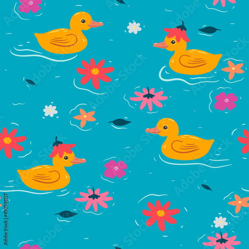 Seamless pattern with cute ducklings and flowers. Vector graphics.