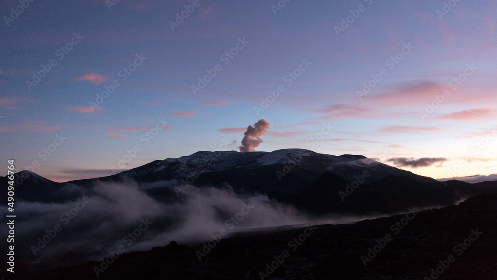 Nevado del Ruiz, active volcano in Colombia, vents smoke and gases before dawn