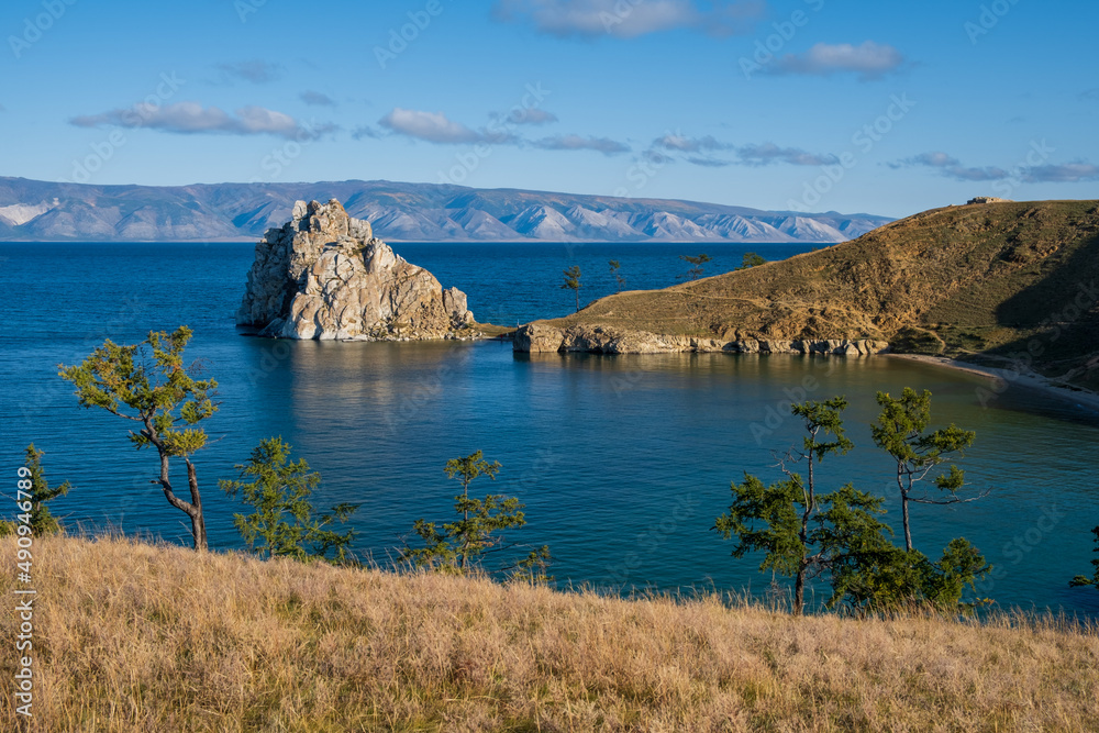 Shamanka Rock on lake Baikal near Khuzhir village at Olkhon island in September, Siberia, Russia. Lake Baikal is the deepest freshwater lake in the world