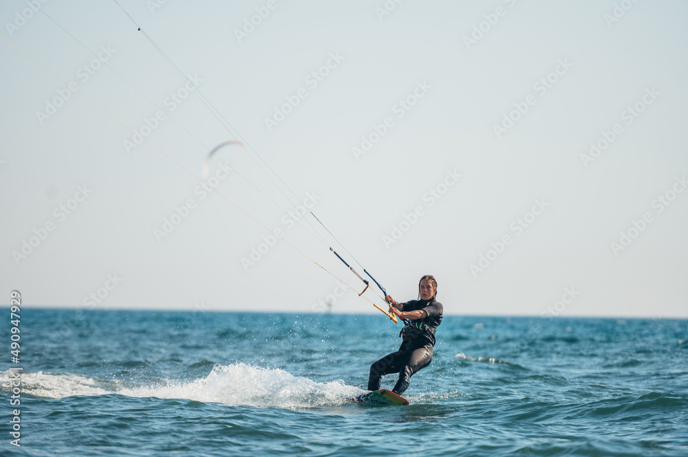 Woman kitesurfing on the ocean waters