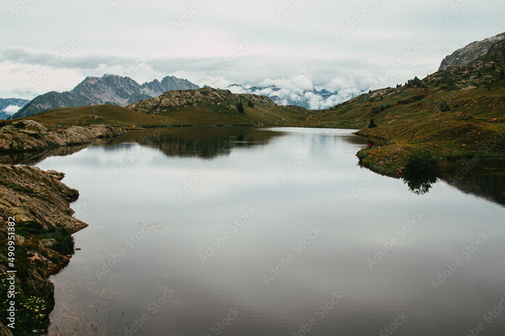 High altitude lake and mountain ranges in a cold and austere atmosphere