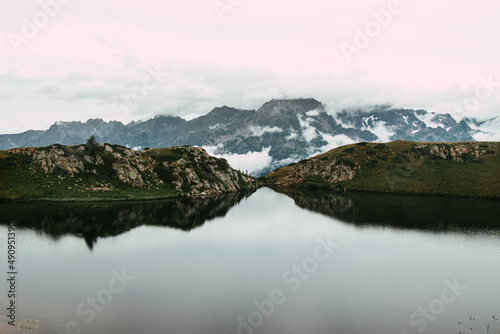 High altitude lake and mountain ranges in a cold and austere atmosphere