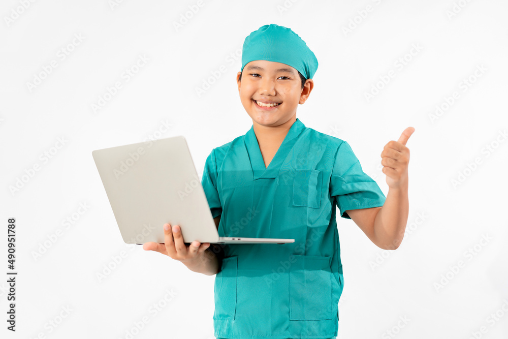 Portrait of Young Asian Boy Dressing to be Doctor, Holding Laptop Isolate on White Background, Education Concept Portrait of Young Asian Boy Dressing to be Doctor, Holding Laptop Isolate on White Background, Education Concept