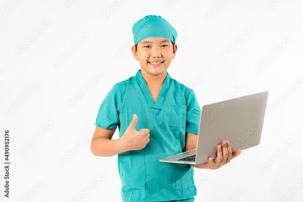 Portrait of Young Asian Boy Dressing to be Doctor, Holding Laptop Isolate on White Background, Education Concept Portrait of Young Asian Boy Dressing to be Doctor, Holding Laptop Isolate on White Background, Education Concept