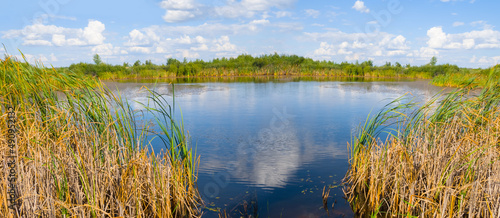quiet small lake among prairies  summer outdoor scene