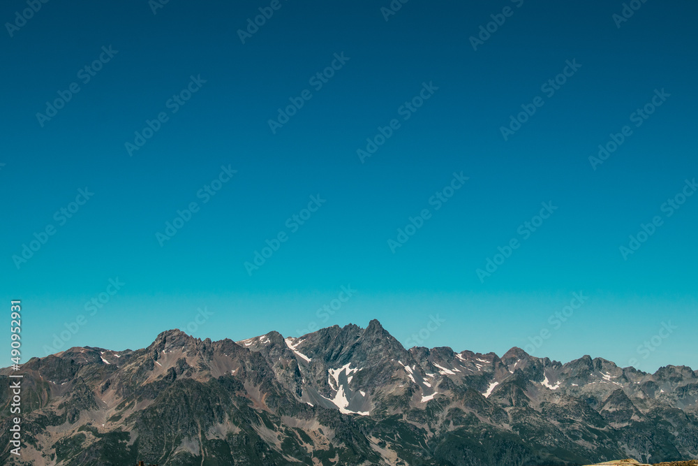 Mountain ranges under the blue sky in French Alpes - apple wallpaper