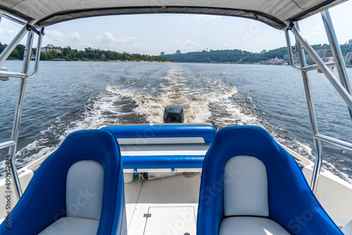 Blue seats in motor yacht. 