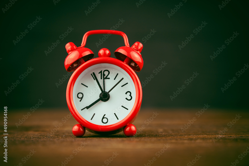 red alarm clock on black background, time concept red alarm clock on black background, time concept