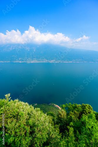 Panorama and aerial view from the town of Gardola over the south lake Garda, Italy - travel destination photo