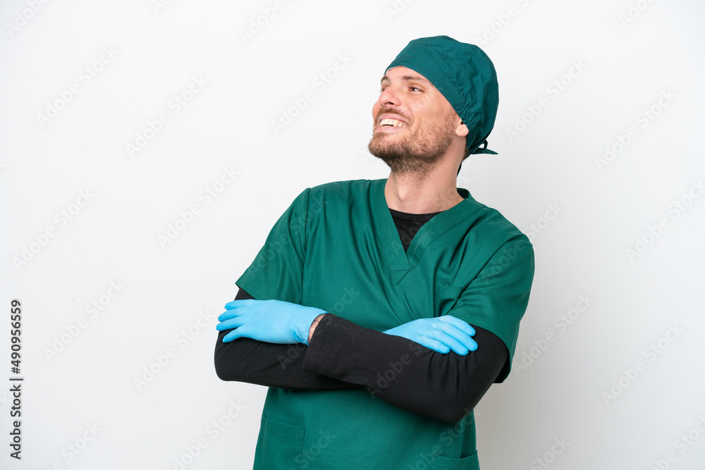 Surgeon Brazilian man in green uniform isolated on white background happy and smiling Surgeon Brazilian man in green uniform isolated on white background happy and smiling