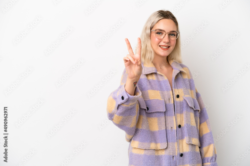 Young caucasian woman isolated on white background smiling and showing victory sign Young caucasian woman isolated on white background smiling and showing victory sign