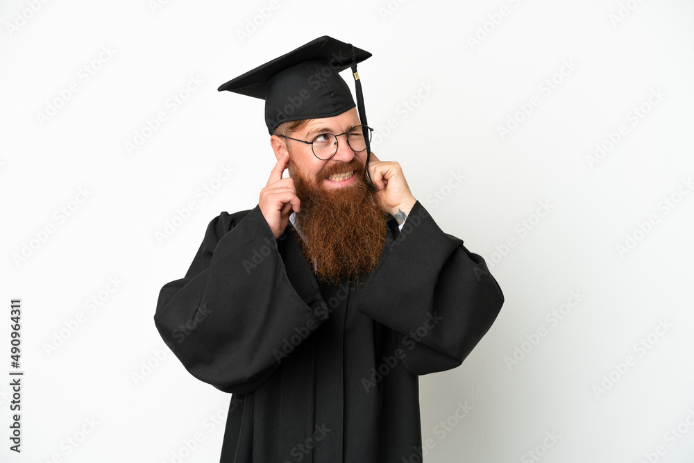 Young university graduate reddish man isolated on white background frustrated and covering ears Young university graduate reddish man isolated on white background frustrated and covering ears