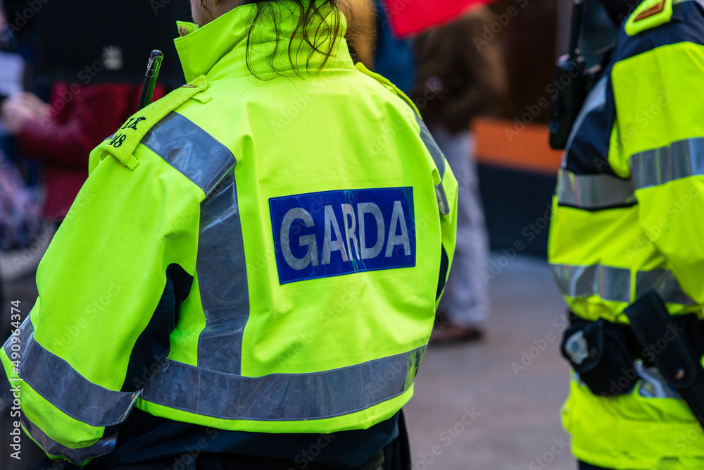 Garda inscription on jacket of policeman Garda inscription on jacket of policeman