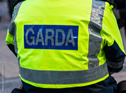 Garda inscription on jacket of policeman
