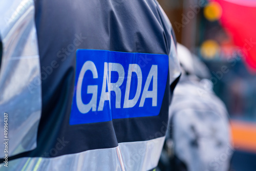 Garda inscription on jacket of policeman