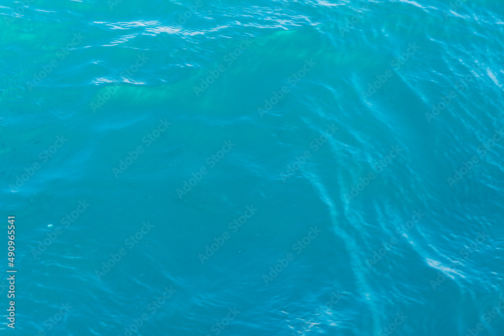 Natural sea blue background sparkling clear water
