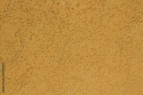 Texture or background of rough wall plastered with sand and cement in earthy tones